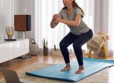 Beginner doing simple exercises at home for weight loss and fitness improvement