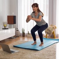 Beginner doing simple exercises at home for weight loss and fitness improvement