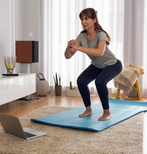 Beginner doing simple exercises at home for weight loss and fitness improvement