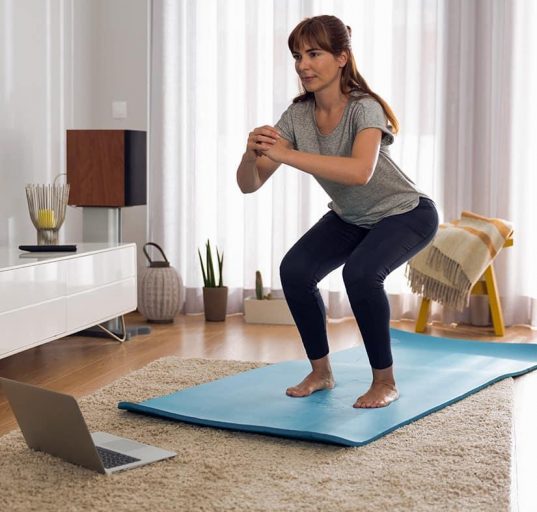 Beginner doing simple exercises at home for weight loss and fitness improvement