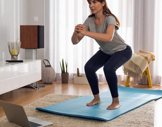 Beginner doing simple exercises at home for weight loss and fitness improvement