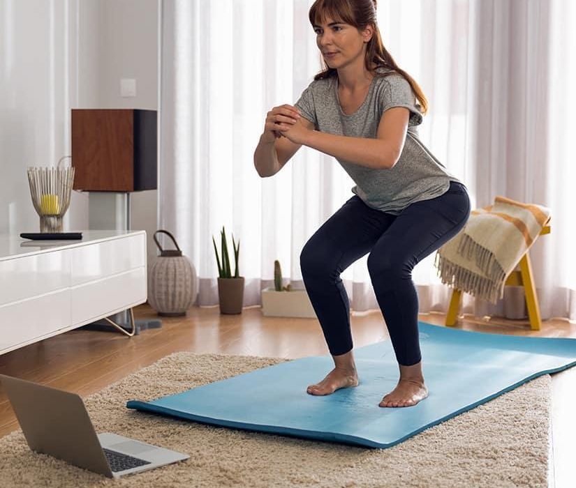 Beginner doing simple exercises at home for weight loss and fitness improvement